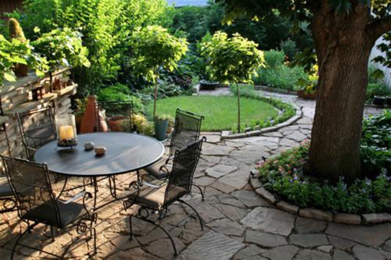 patio in garden natural stone pavers
